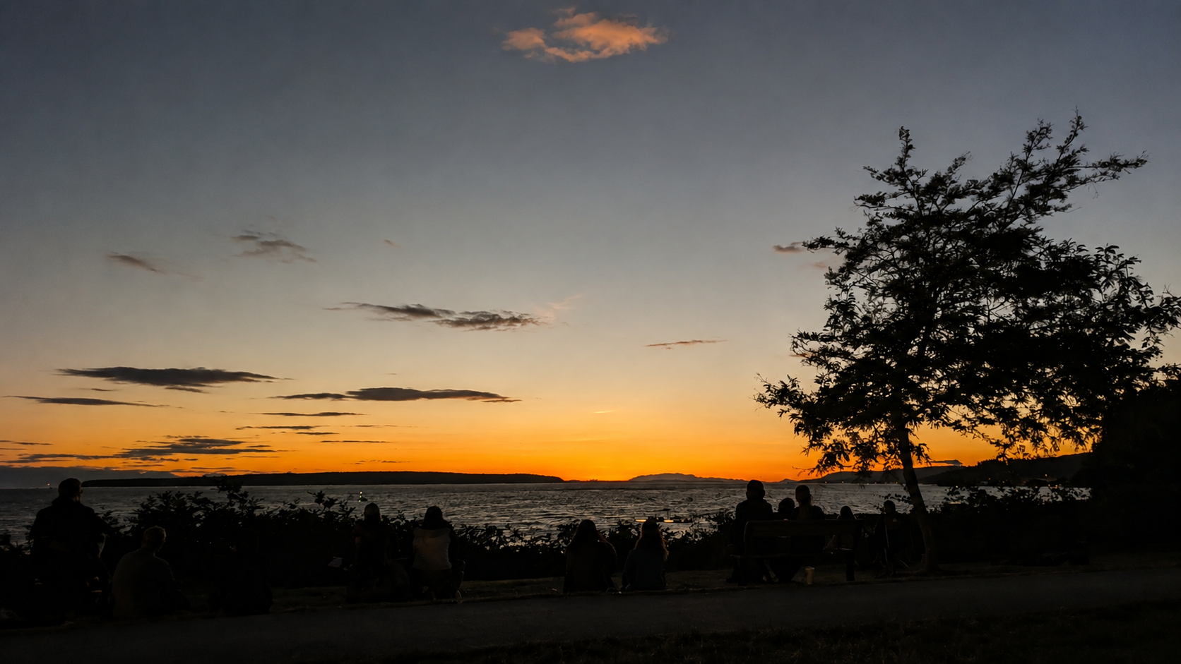 People gathered along the Powell River waterfront at sunset